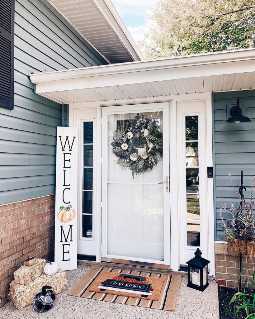 fall front porch decor with hay bales