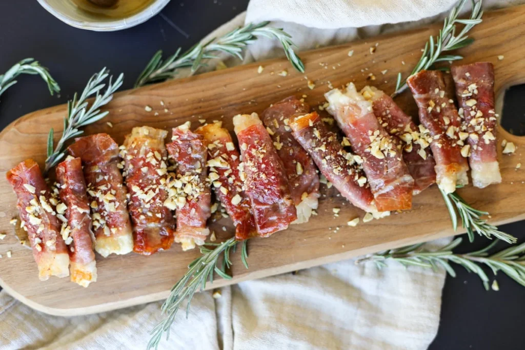 Crispy Prosciutto Wrapped Boursin Cheese with Honey and Chopped Nuts